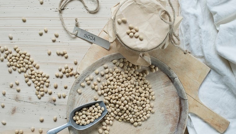 Soybeans on wooden background